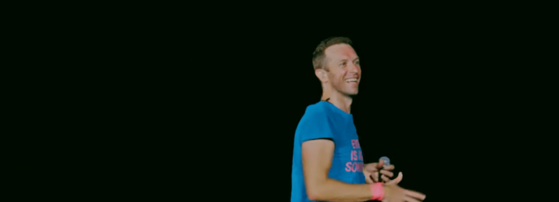 Chris Martin on stage during a Coldplay concert.